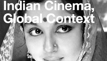 Close up of Indian actress smiling in black and white